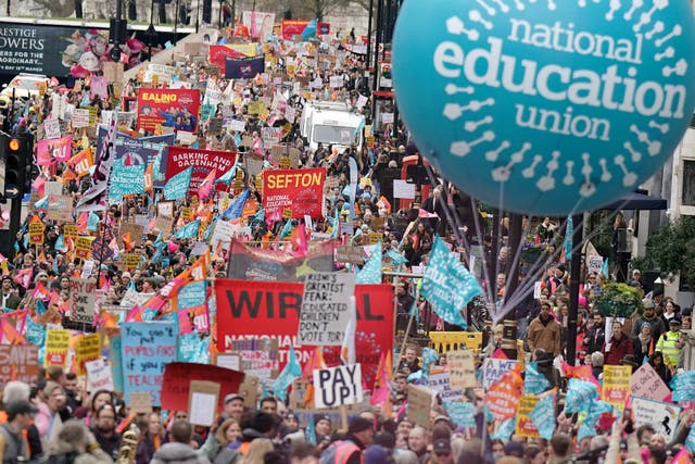 Striking members of the National Education Union (NEU) on Piccadilly march to a rally in Trafalgar Square, central London, in a long-running dispute over pay. Picture date: Wednesday March 15, 2023.