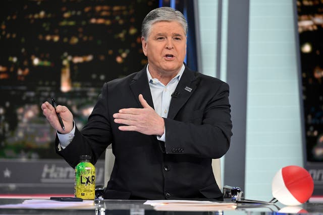 <p>Fox News commentator Sean Hannity speaks during an interview at Fox News Studio</p>