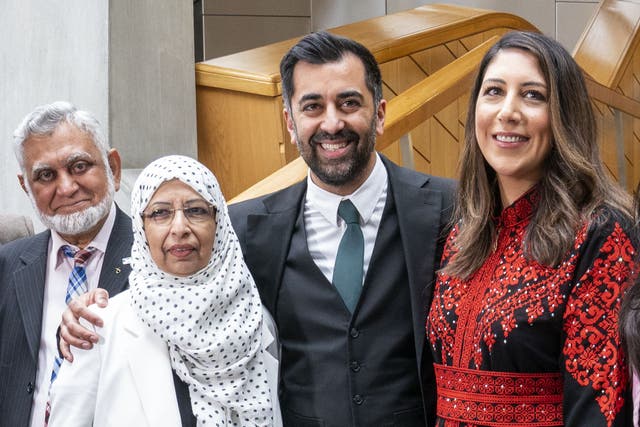 Humza Yousaf, with his wife Nadia El-Nakla, father Muzaffar Yousaf and mother Shaaista Bhutta the Garden Lobby after being voted the new First Minister at the Scottish Parliament in Edinburgh (Jane Barlow/PA)