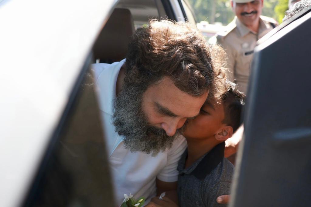 A young boy rushes to kiss Rahul Gandhi in Wayanad as the leader visited his constituency for a regular trip in March