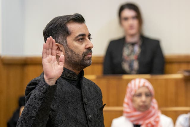 Humza Yousaf takes the oath as he is sworn in as First Minister of Scotland at the Court of Session, Edinburgh (Jane Barlow/PA)
