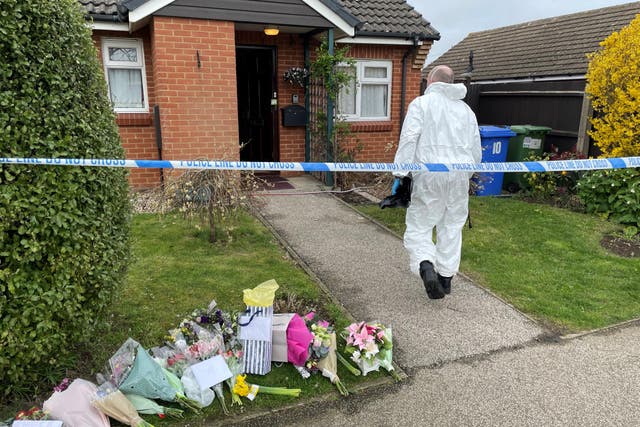 A forensic officer in Grayson Avenue, Pakefield, Suffolk, as police investigate the murder of pensioner Joy Middleditch (Sam Russell/PA)