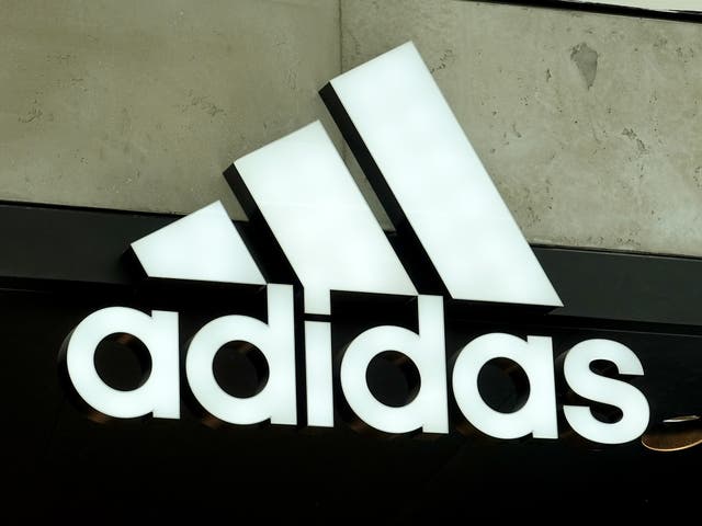 <p>An Adidas sign at the entrance to the store on August 12, 2021 in Miami, Florida</p>