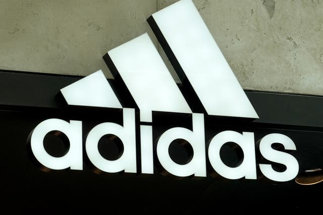 <p>An Adidas sign at the entrance to the store on August 12, 2021 in Miami, Florida</p>