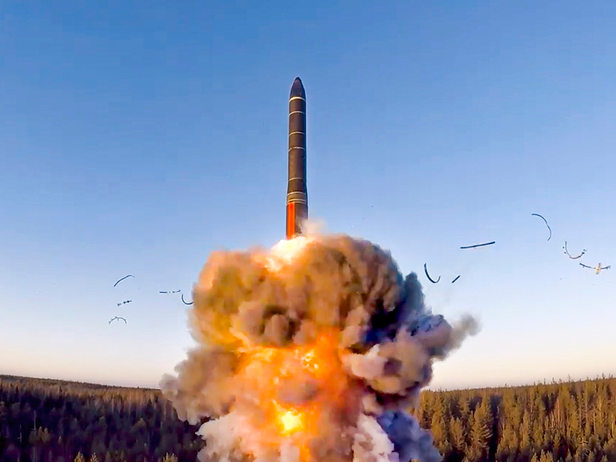 FILE - In this file photo taken from a video distributed by Russian Defense Ministry Press Service, on Dec. 9, 2020, a rocket launches from missile system as part of a ground-based intercontinental ballistic missile test launched from the Plesetsk facility in northwestern Russia