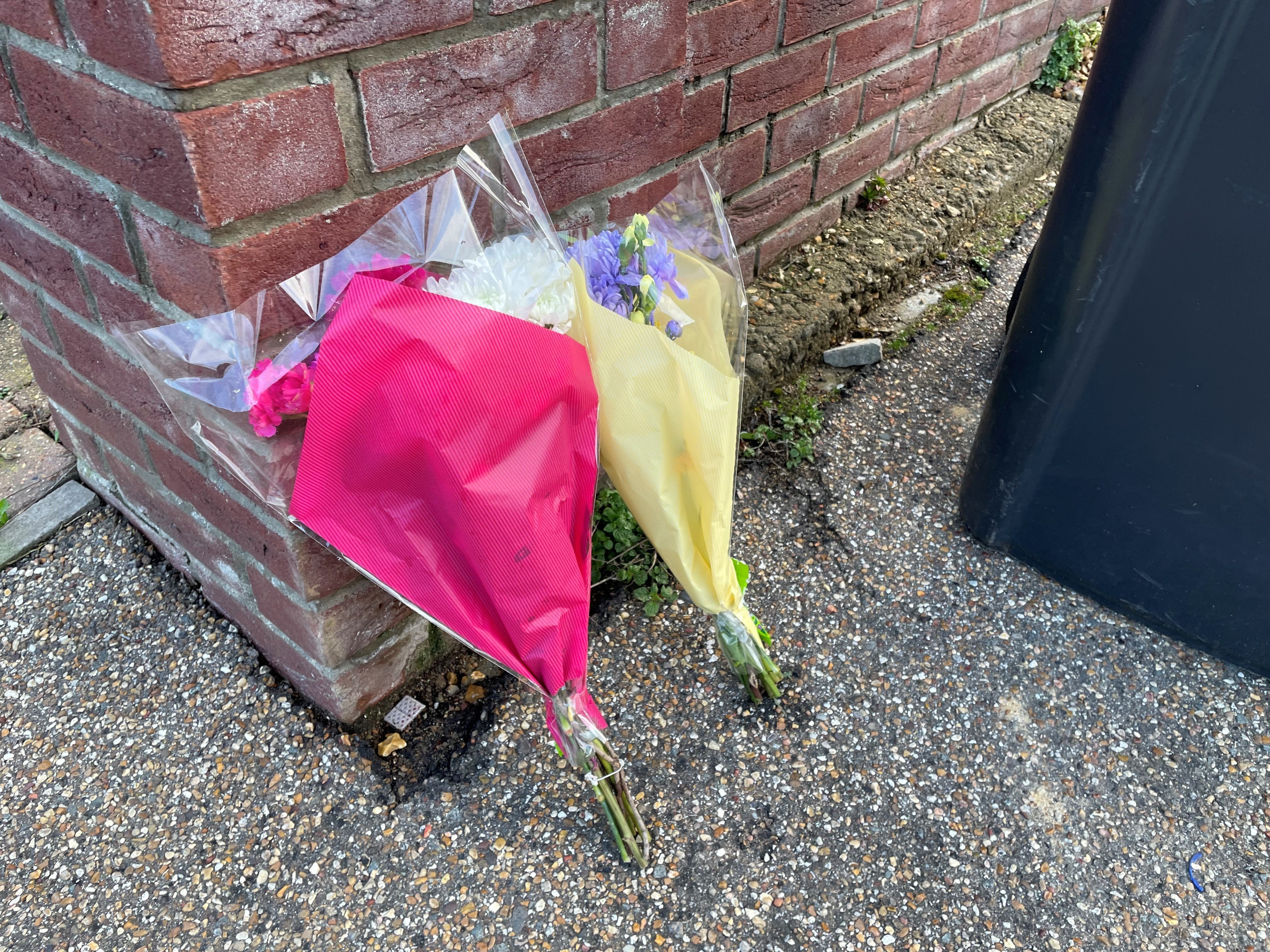 Flowers left at the scene in The Row in Sutton, near Ely, Cambridgeshire