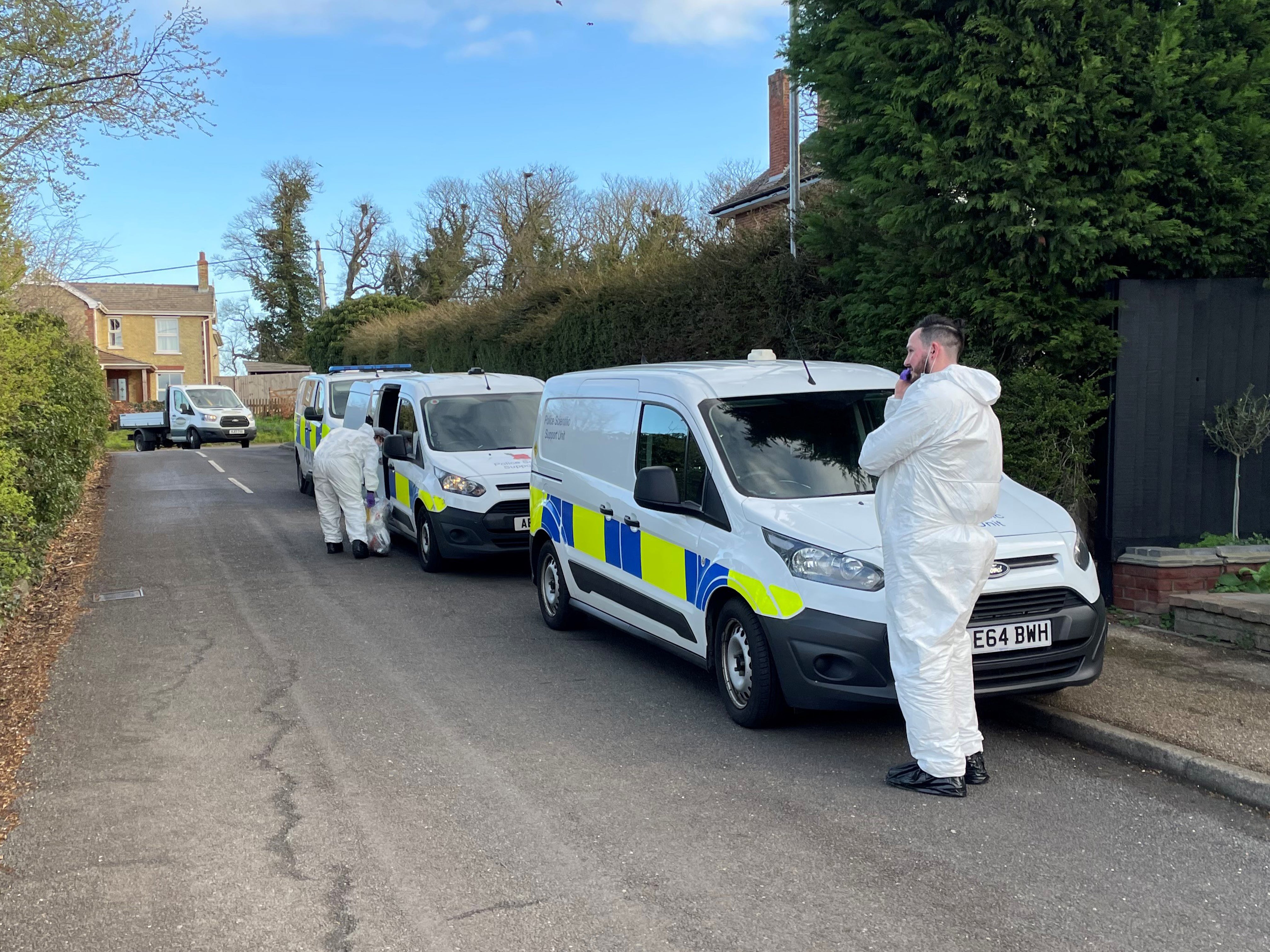 Police forensics officers at the scene in The Row in Sutton