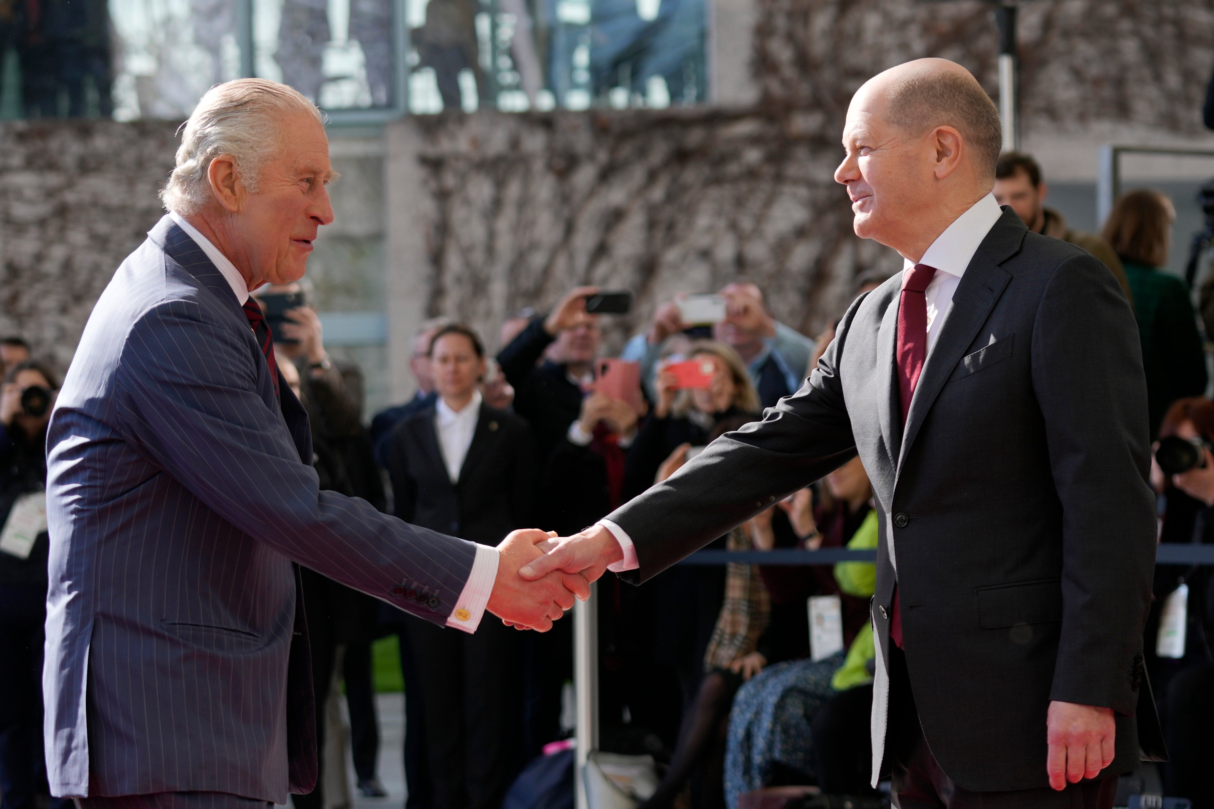 German Chancellor Olaf Scholz welcomes Charles at the chancellery in Berlin