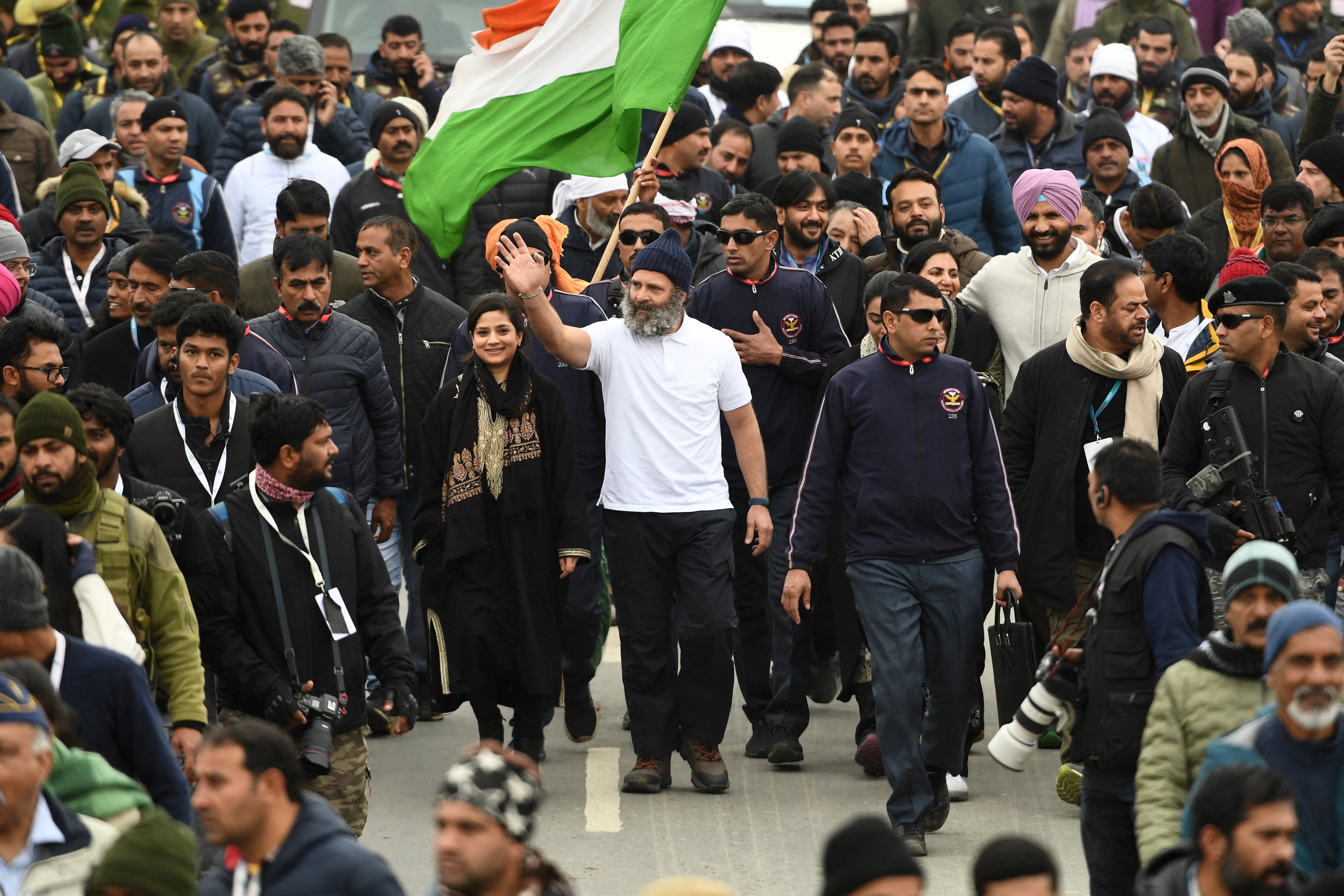 Indian Congress leader Rahul Gandhi (centre, in white) with Iltija Mufti (left) daughter of former chief minister of Jammu and Kashmir Mehbooba Mufti (not in photo) walk during the ‘Bharat Jodo Yatra’ in Anantnag, south Kashmir