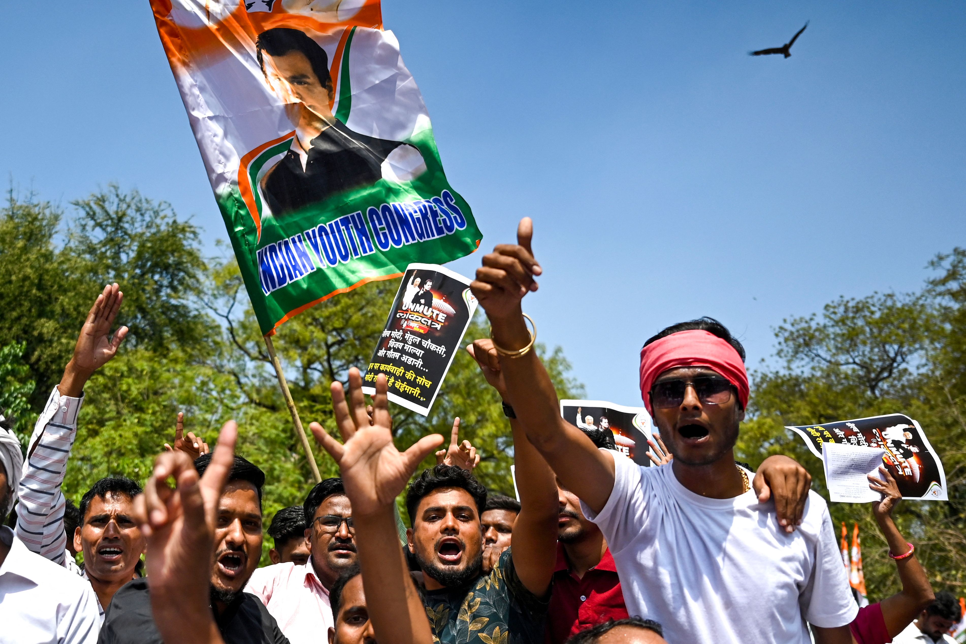 India’s Congress party activists and supporters protest against conviction of Congress party leader Rahul Gandhi in a criminal defamation case, in New Delhi on 27 March 2023