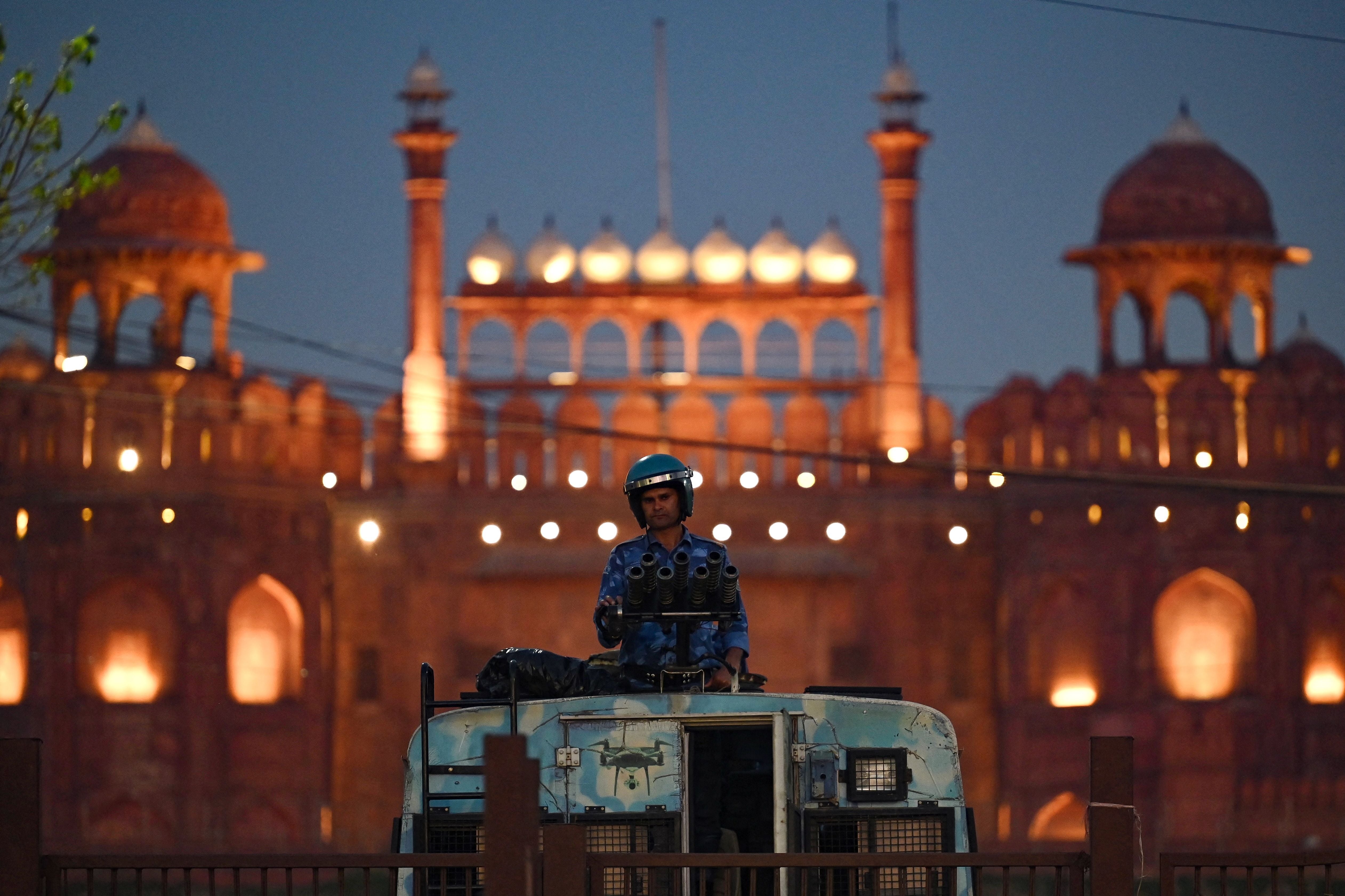 A soldier stands guard outside the Red Fort during protests over Rahul Gandhi’s criminal defamation case