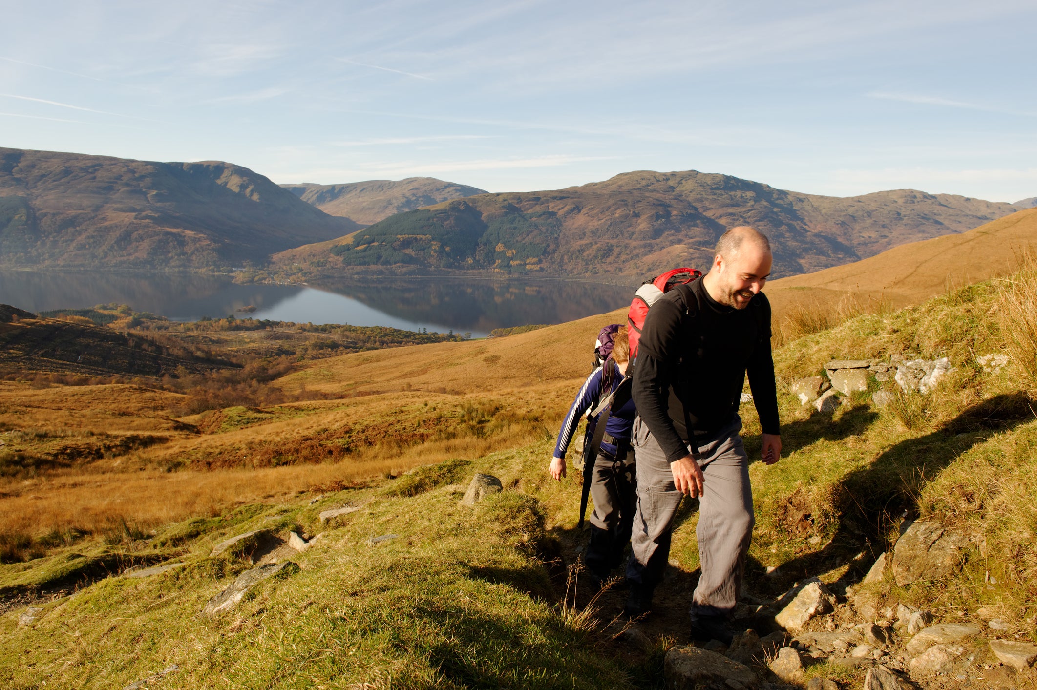 Climbers approaching the summit of Ben Lomond in autumn
