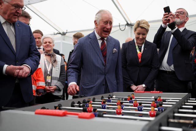 The King and Berlin’s governing mayor Franziska Giffey during a visit to the refugee arrival centre at Tegel airport, Berlin (Phil Noble/PA)