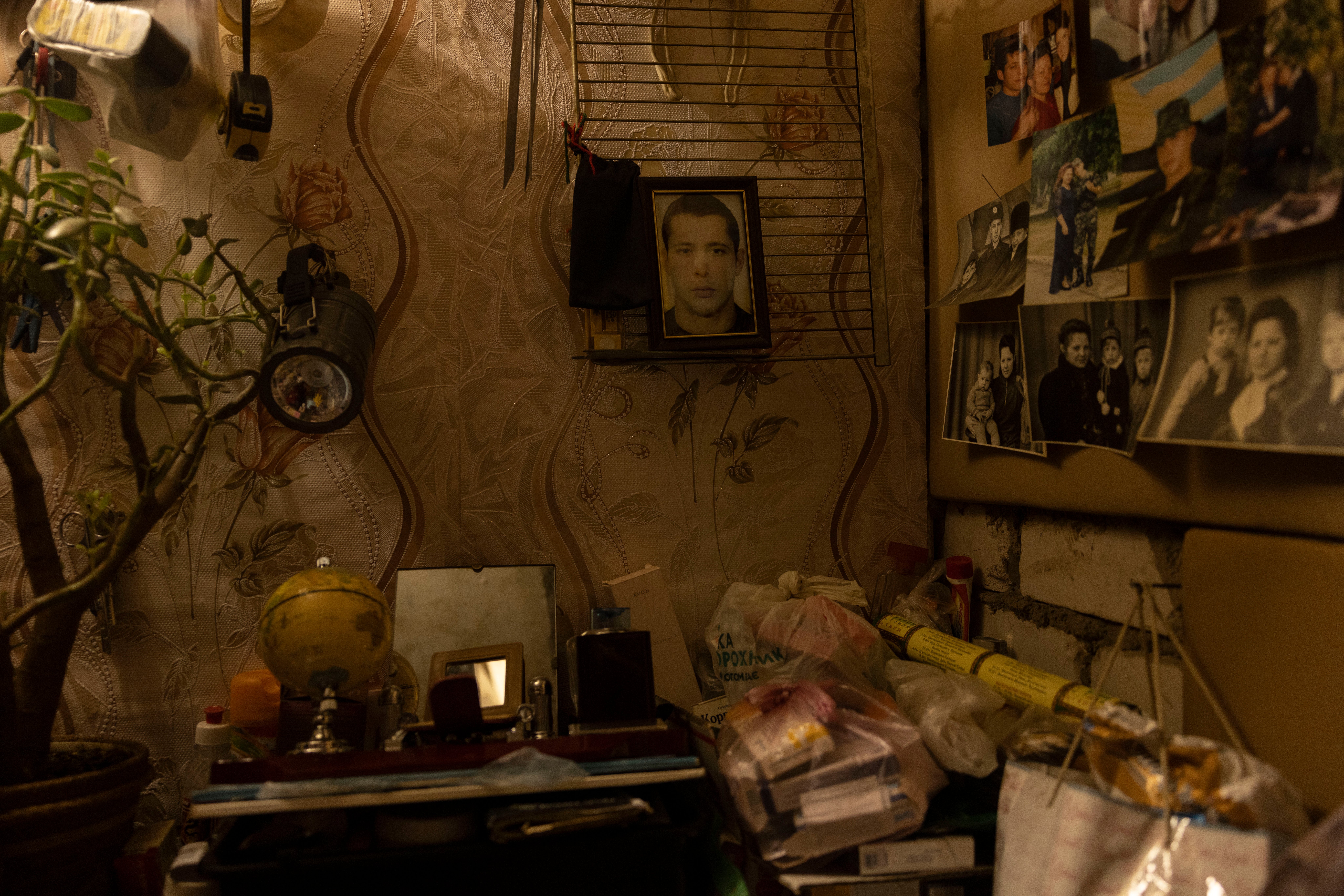 Surzhon’s makeshift bedroom is decorated with family photographs, including a picture of her late son, Pavlo