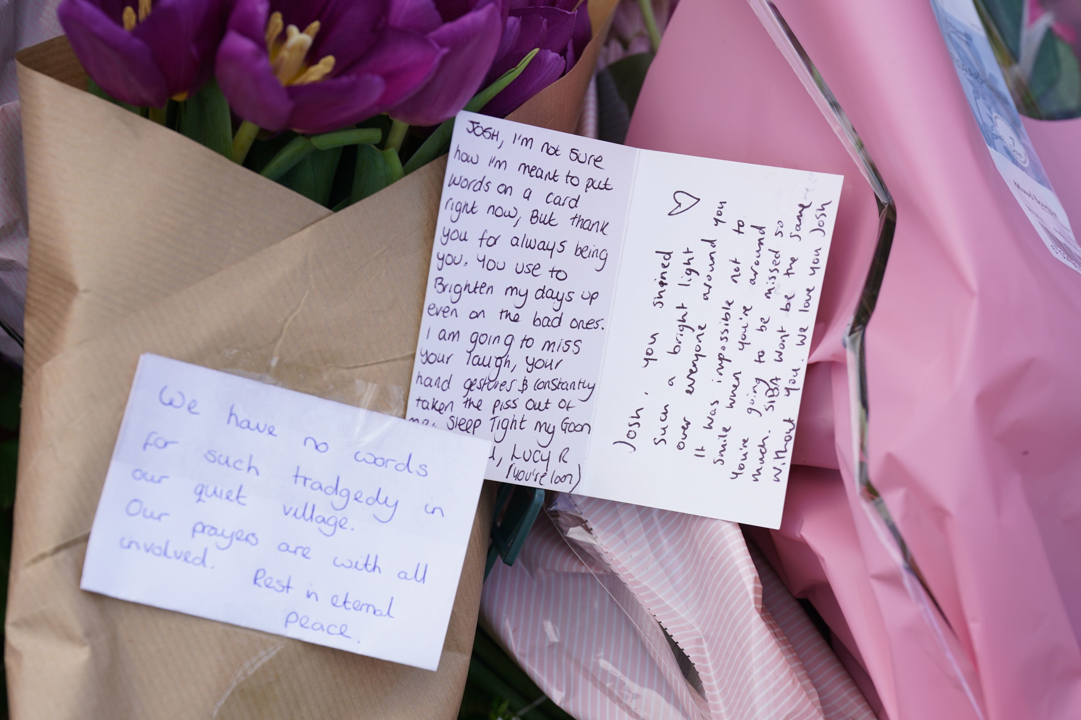 Notes left in tribute to the victims at the scene