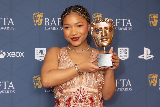 Laya DeLeon Hayes with the performer in a supporting role award for their performance as Angrbooa in God Of War Ragnarok at the Bafta Games Awards at the Queen Elizabeth Hall, Southbank Centre, London (Suzan Moore/PA)