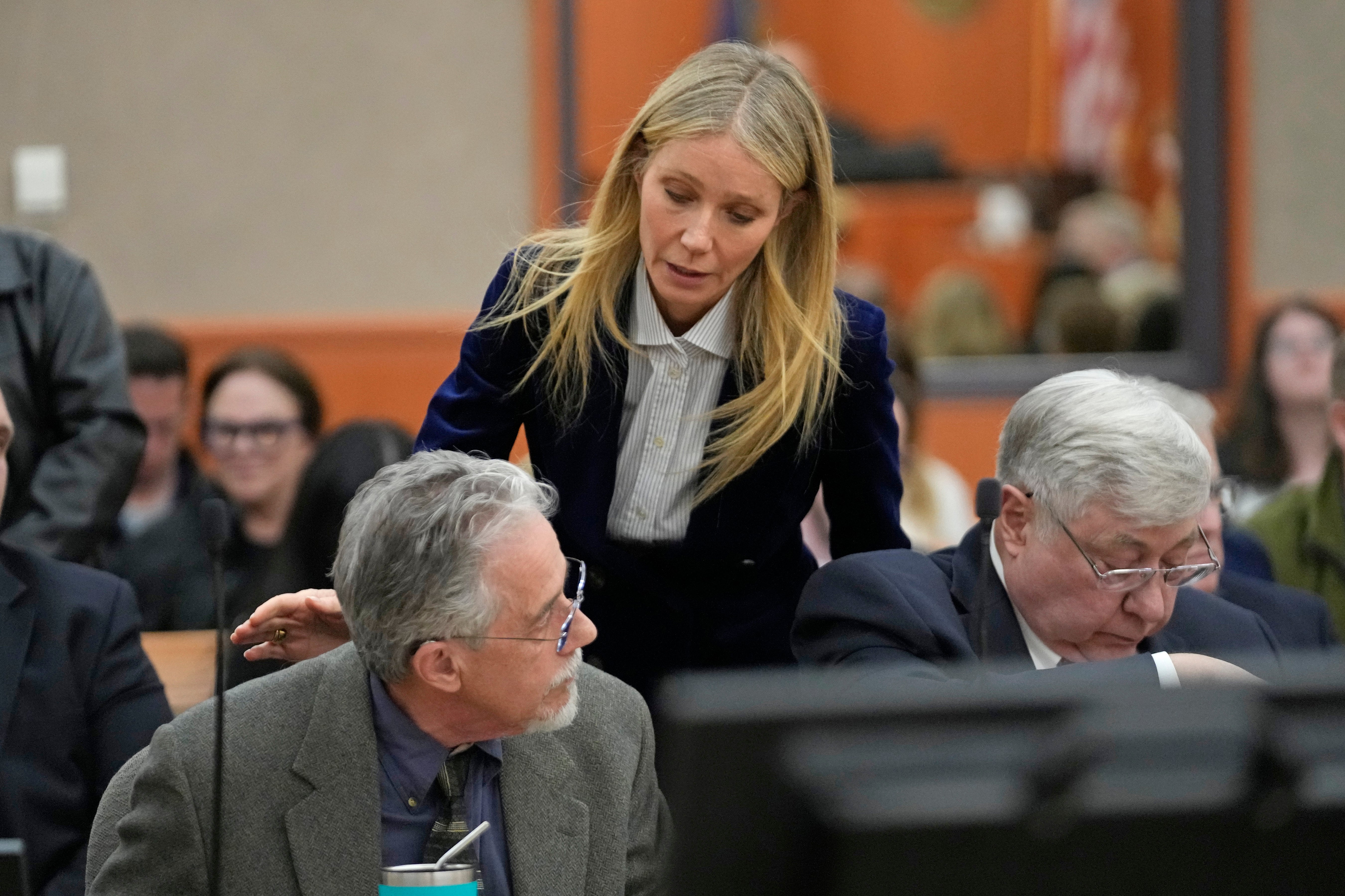 Gwyneth Paltrow speaks with retired optometrist Terry Sanderson, left, as she walks out of the courtroom following the reading of the verdict in their lawsuit trial, Thursday, March 30, 2023, in Park City, Utah