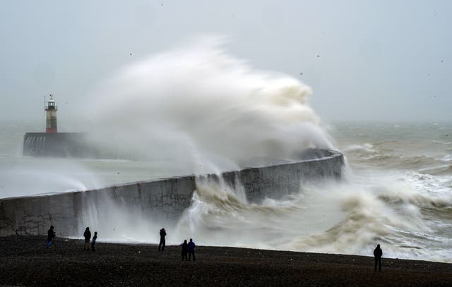 <p>FILE-A wave crashes over Newhaven lighthouse at West Quay in East Sussex, following on from Storm Eunice. </p>