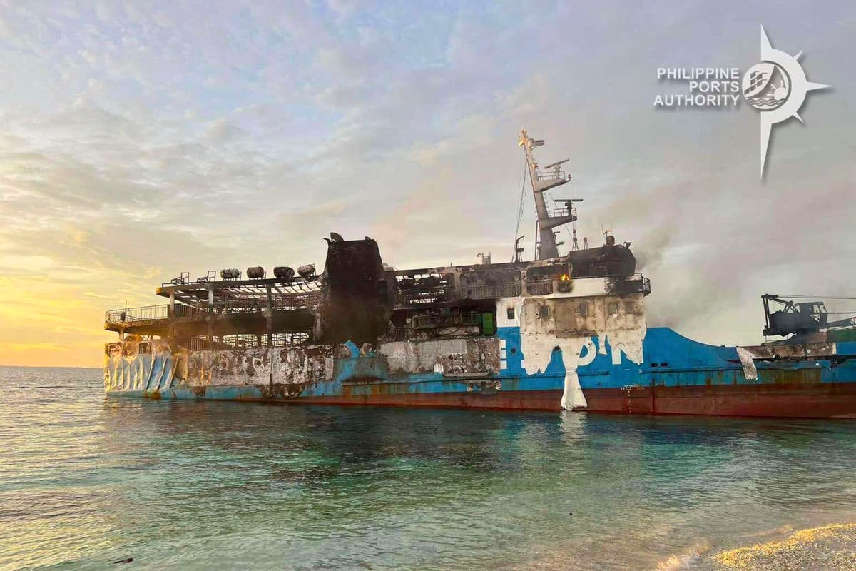 Death scene in burned Filipino ferry moves rescuers to tears