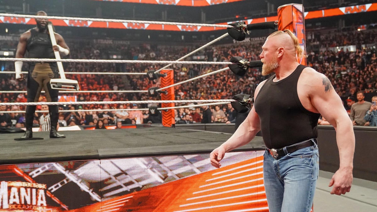 Brock Lesnar (r) tangles with Omos at WrestleMania