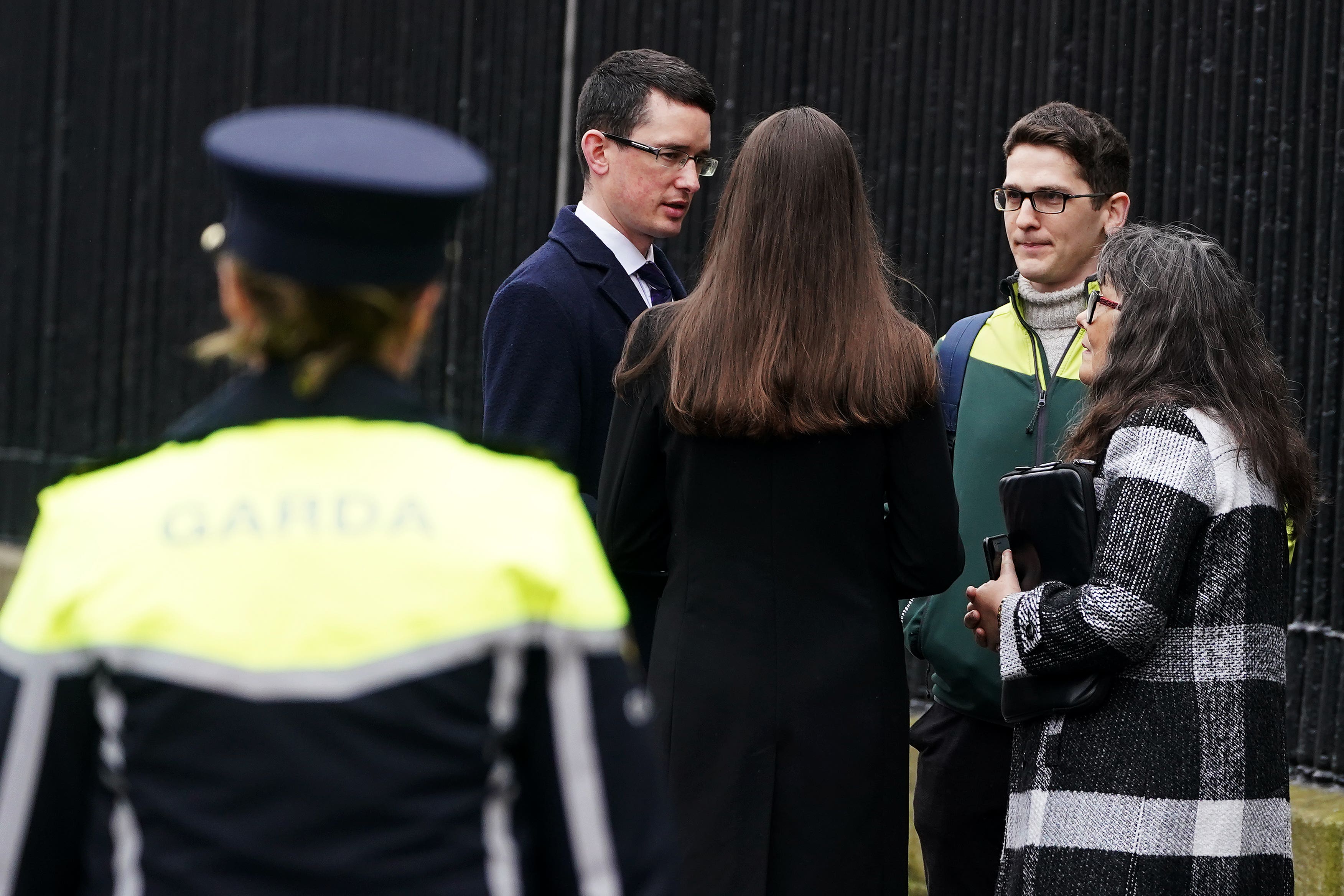 Irish teacher Enoch Burke (left), with his sister Ammi Burke, brother Isaac Burke (second right) and his mother Martina Burke (right) outside the High Court in Dublin (PA)