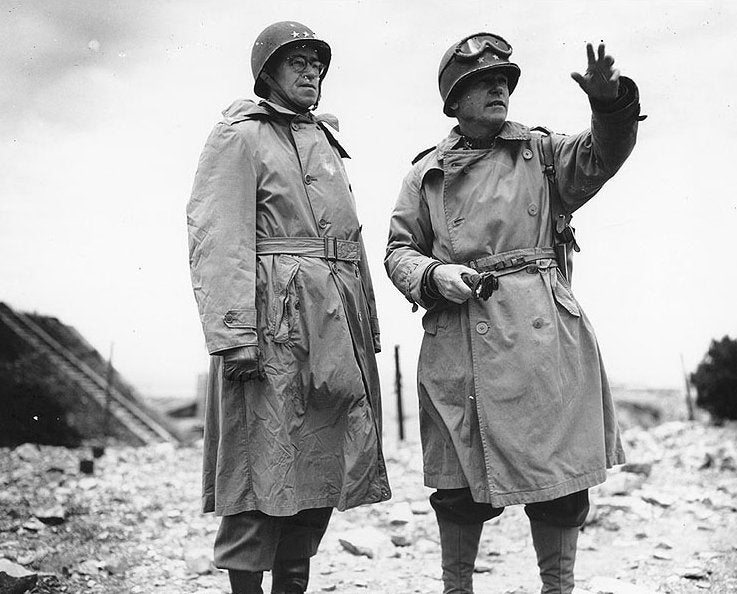 <p>Top Operation Cobra commander, Major General J. Lawton Collins (right) pictured speaking to Lieutenant General Omar Bradley (left) in Normandy in Summer, 1944</p>