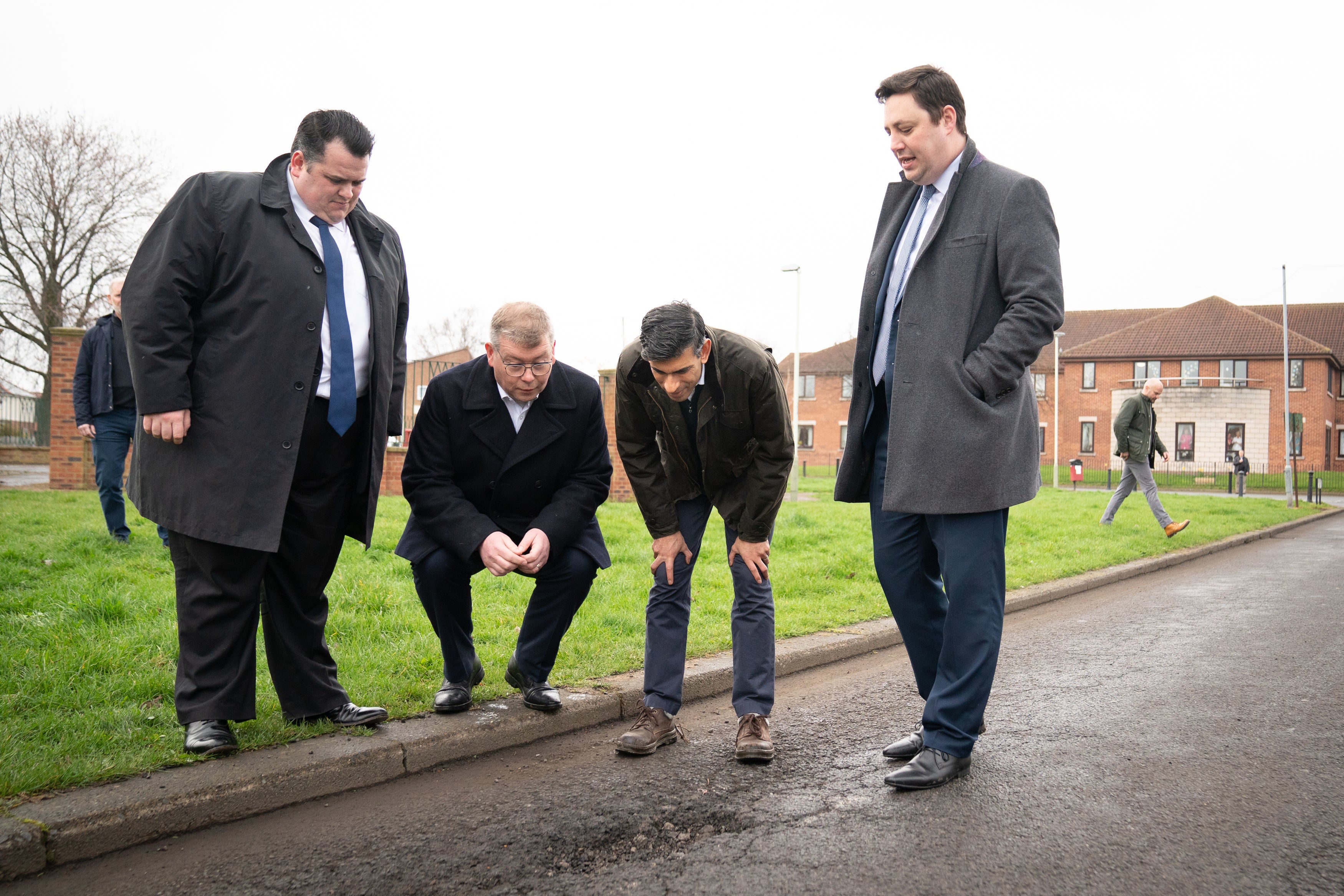 ‘A plague on our roads’: Rishi Sunak inspects a pothole in Darlington, County Durham
