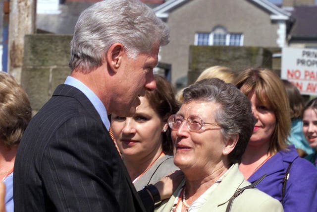 Former US president Bill Clinton meets Joan Wilson, wife of former senator Gordon Wilson and mother of Marie Wilson, a victim of the Poppy Day bombing in November 1987, at the site where the bomb went off in Enniskillen, Co Fermanagh (PA)