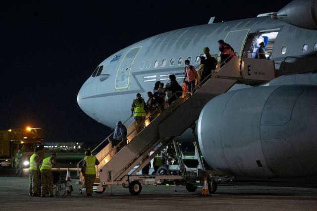 <p>Passengers evacuated from Afghanistan land at RAF Brize Norton in August 2021 </p>