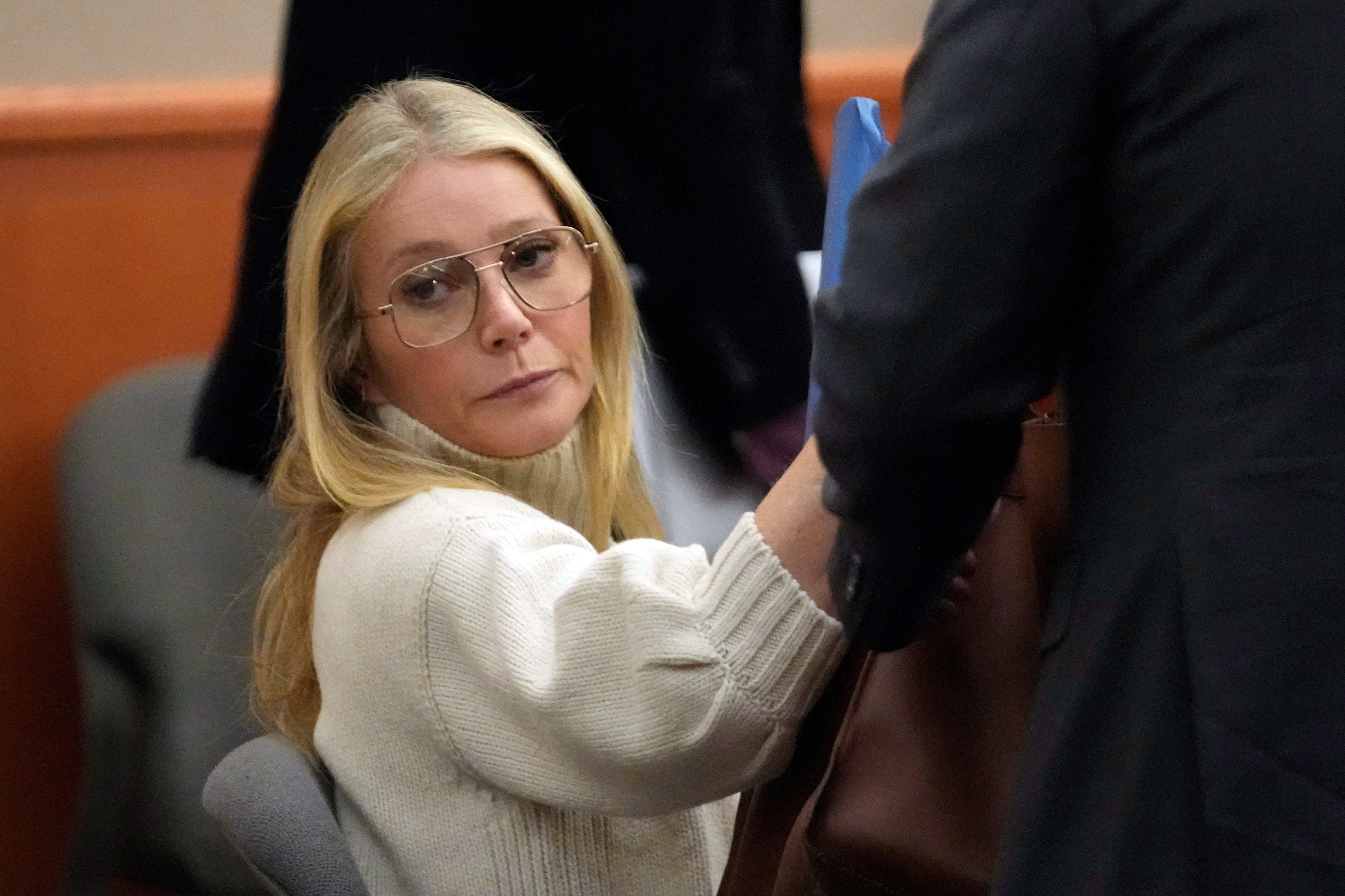 Paltrow wore a cream-coloured turtleneck and 70s aviator glasses on her first day in court