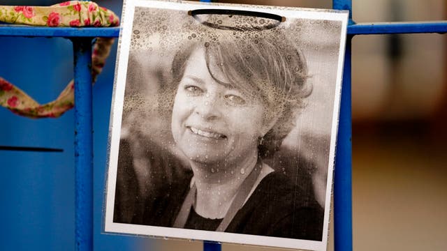 <p>A photograph of Ruth Perry attached to the fence outside John Rankin Schools in Newbury, Berkshire, where headteacher Flora Cooper is planning to refuse entry to Ofsted inspectors following the death of Ms Perry</p>