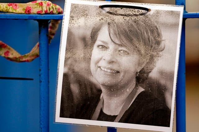 <p>A photograph of Ruth Perry attached to the fence outside John Rankin Schools in Newbury, Berkshire, where headteacher Flora Cooper is planning to refuse entry to Ofsted inspectors following the death of Ms Perry</p>