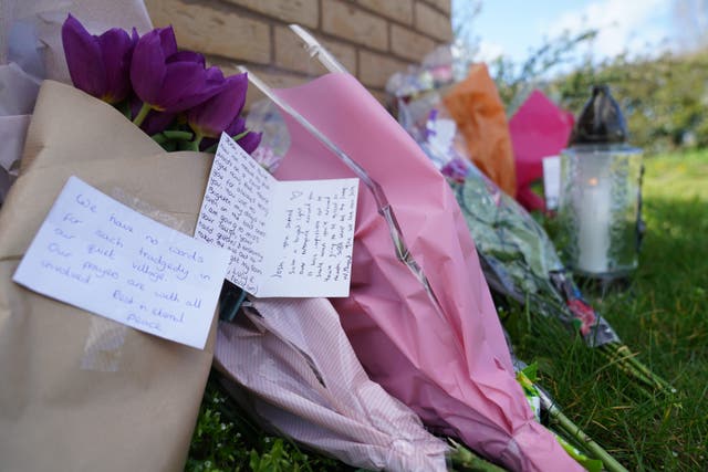 Flowers with messages in Meridian Close, Bluntisham (Joe Giddens/PA)