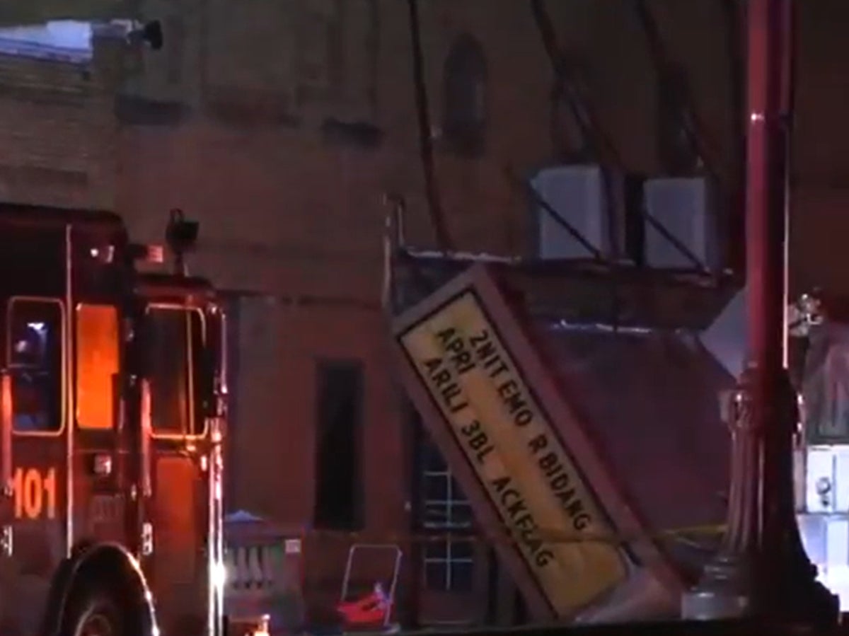 One dead, dozens injured in theatre roof collapse as tornado rips through Illinois