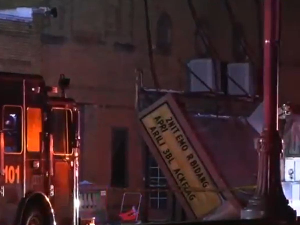 One dead dozens injured in theatre roof collapse as tornado rips through Illinois