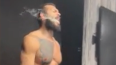 Andrew Tate paces and smokes cigar hours after house arrest release from jail