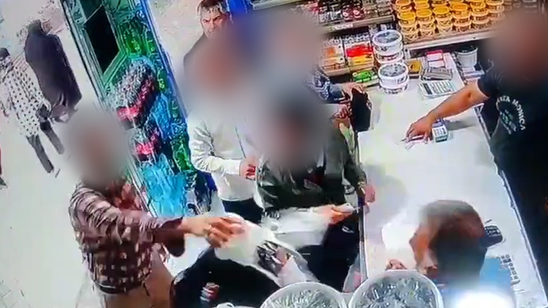 Moment man throws yoghurt on two women not wearing hijab in Iran