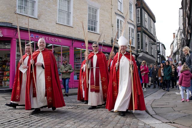 The Archbishop of Canterbury Justin Welby (right) leads a Palm Sunday procession through Canterbury in Kent ahead of the Palm Sunday eucharist in the city’s Cathedral (Gareth Fuller/PA)