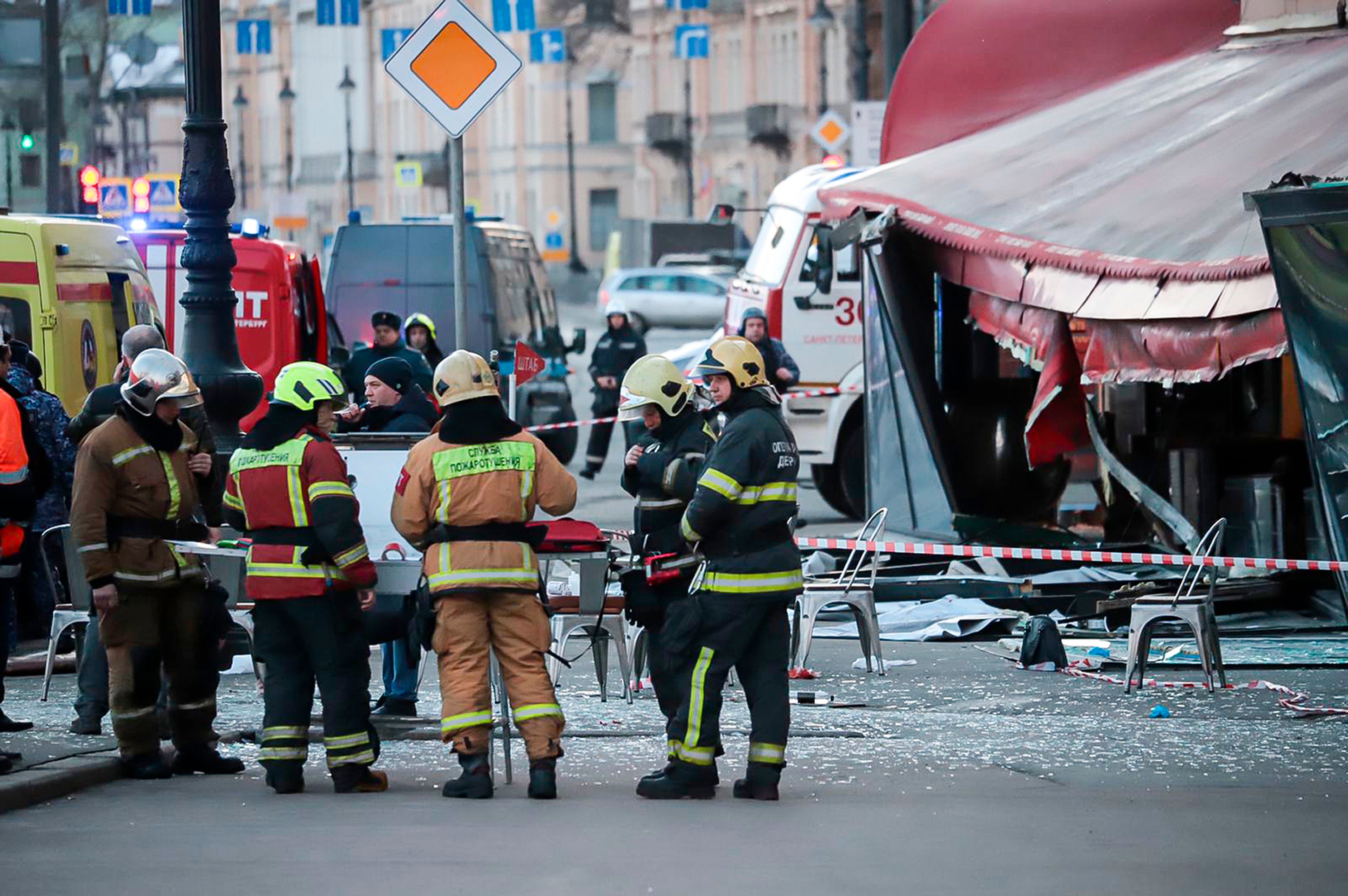 Russian Emergency Situations Ministry stand at the side of an explosion at a cafe in St. Petersburg, Russia