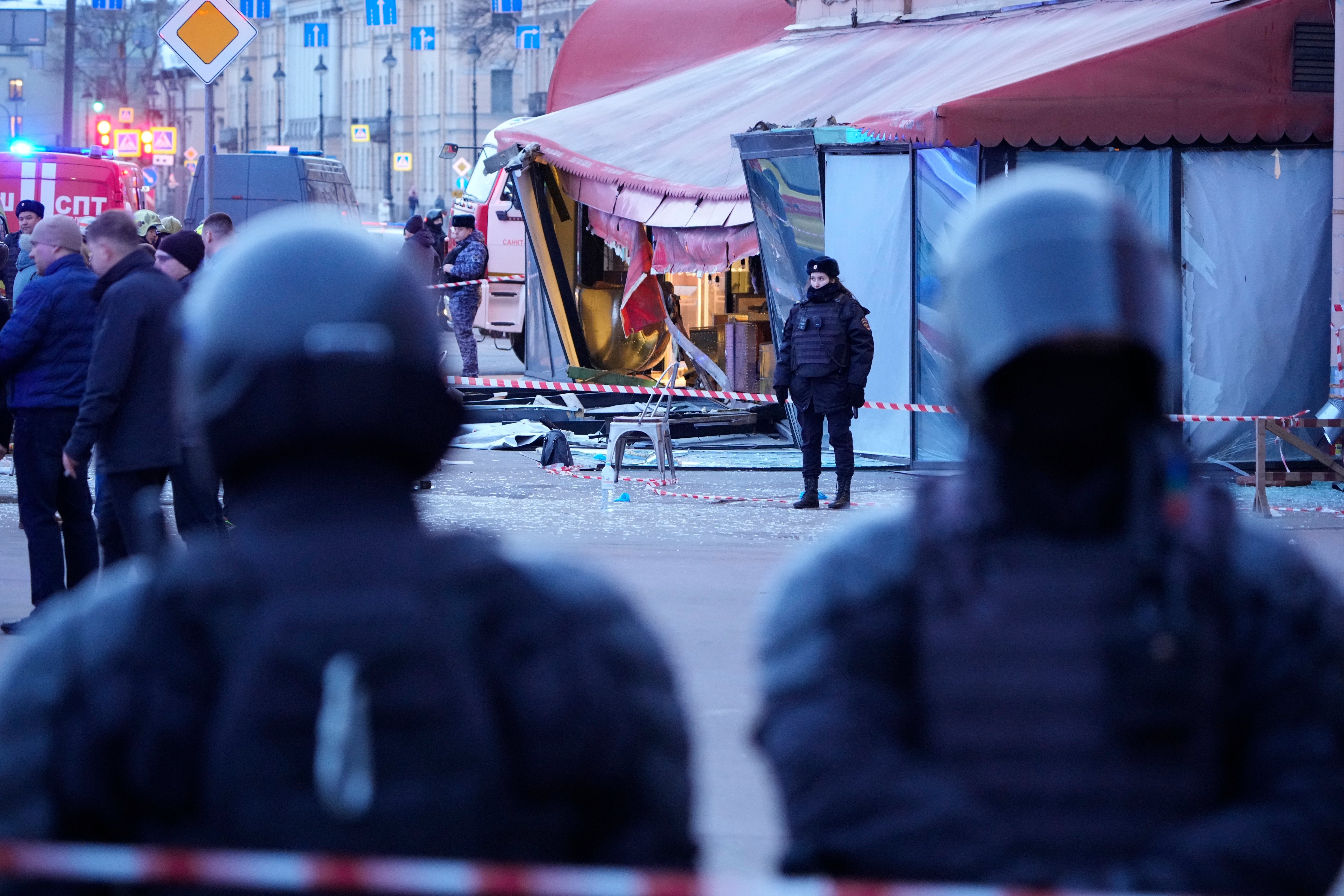 <p>Russian police officers are seen at the site of an explosion at a cafe in St. Petersburg, Russia</p>