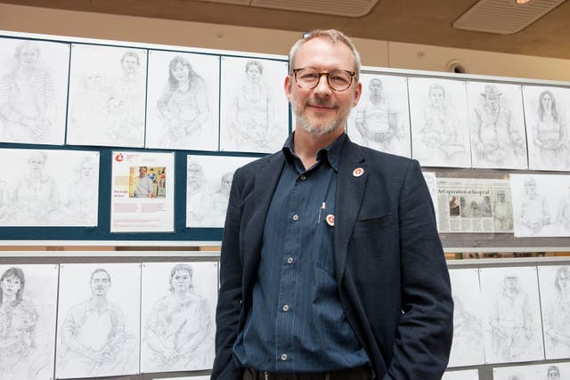A resident artist who draws patients undergoing treatment at a cancer care centre has described the “unique, intimate experience” he has dedicated nearly a decade to (Daniela Sbrisny/AP)