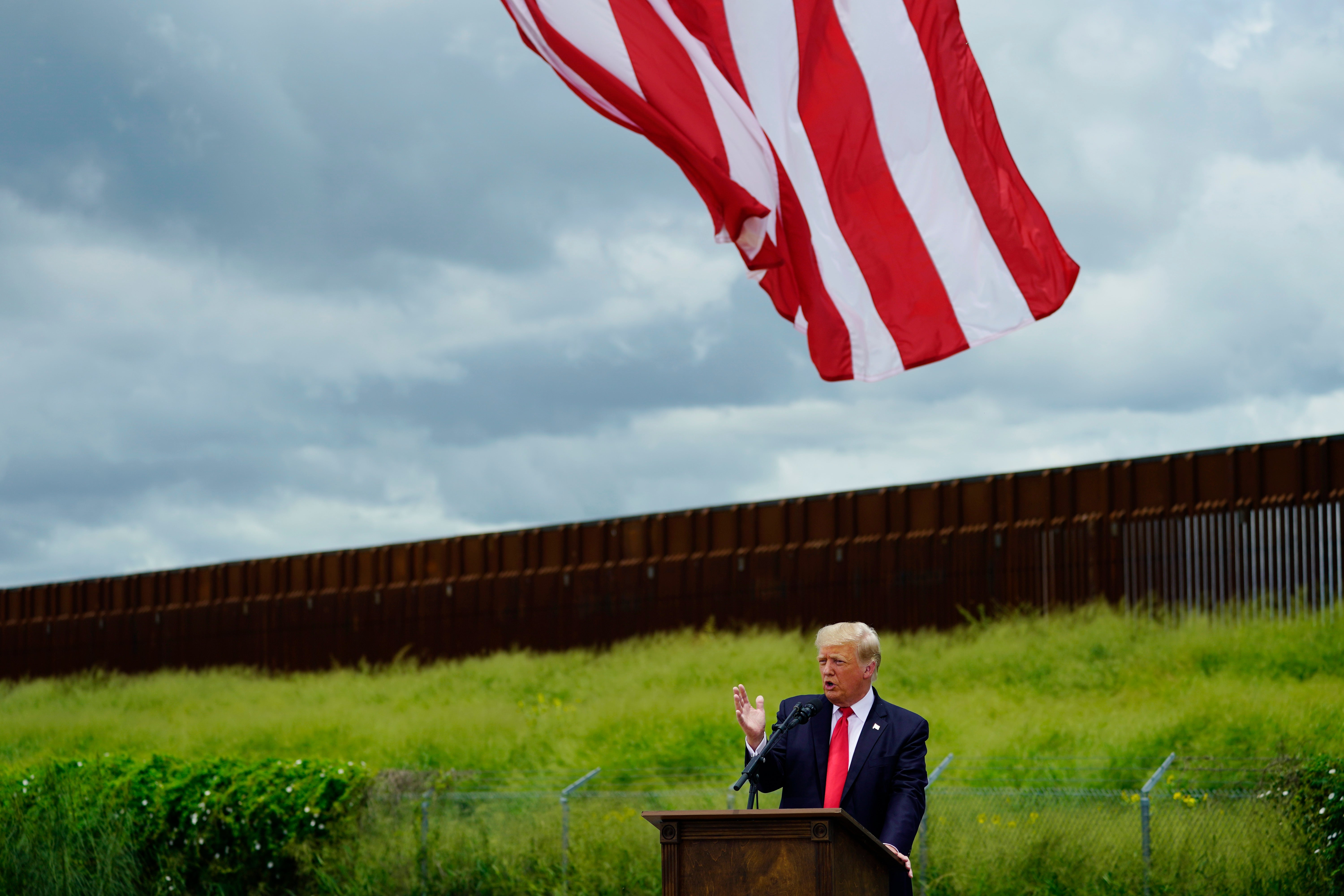 Former President Donald Trump speaks during a visit to an unfinished section of border wall with Texas