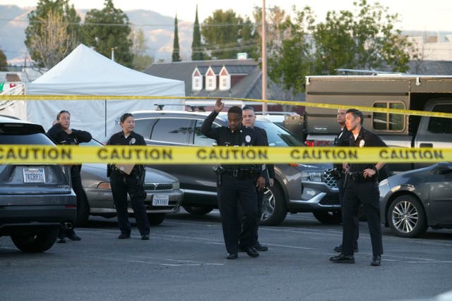 <p>Los Angeles police investigate the scene of a shooting in a shopping center parking lo</p>