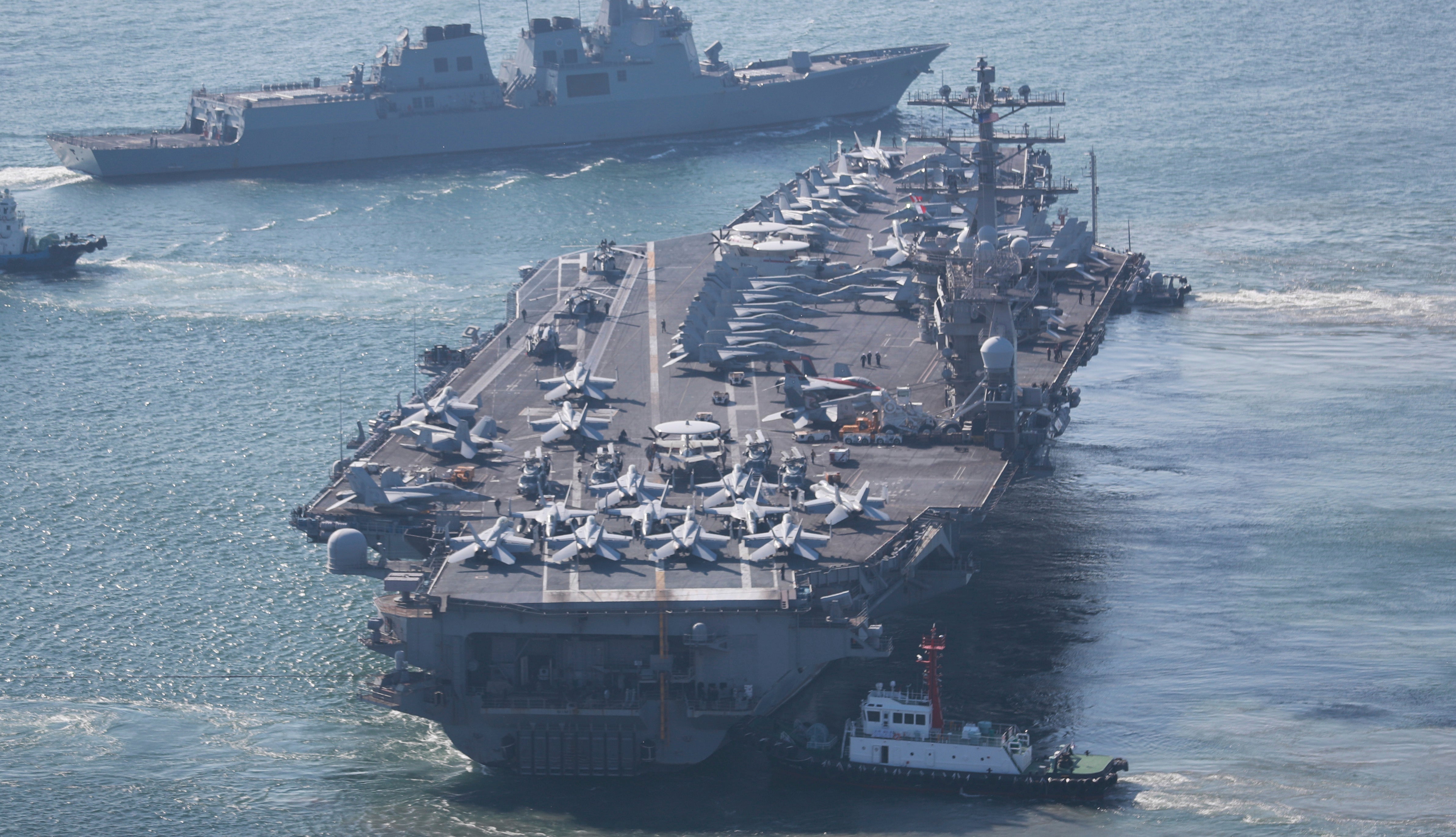 The US Navy’s nuclear-powered aircraft carrier USS Nimitz departs a naval base in Busan, South Korea, Sunday, 2 April 2023