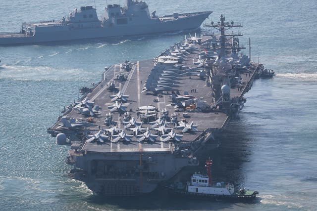 <p>The US Navy’s nuclear-powered aircraft carrier USS Nimitz departs a naval base in Busan, South Korea, Sunday, 2 April 2023</p>