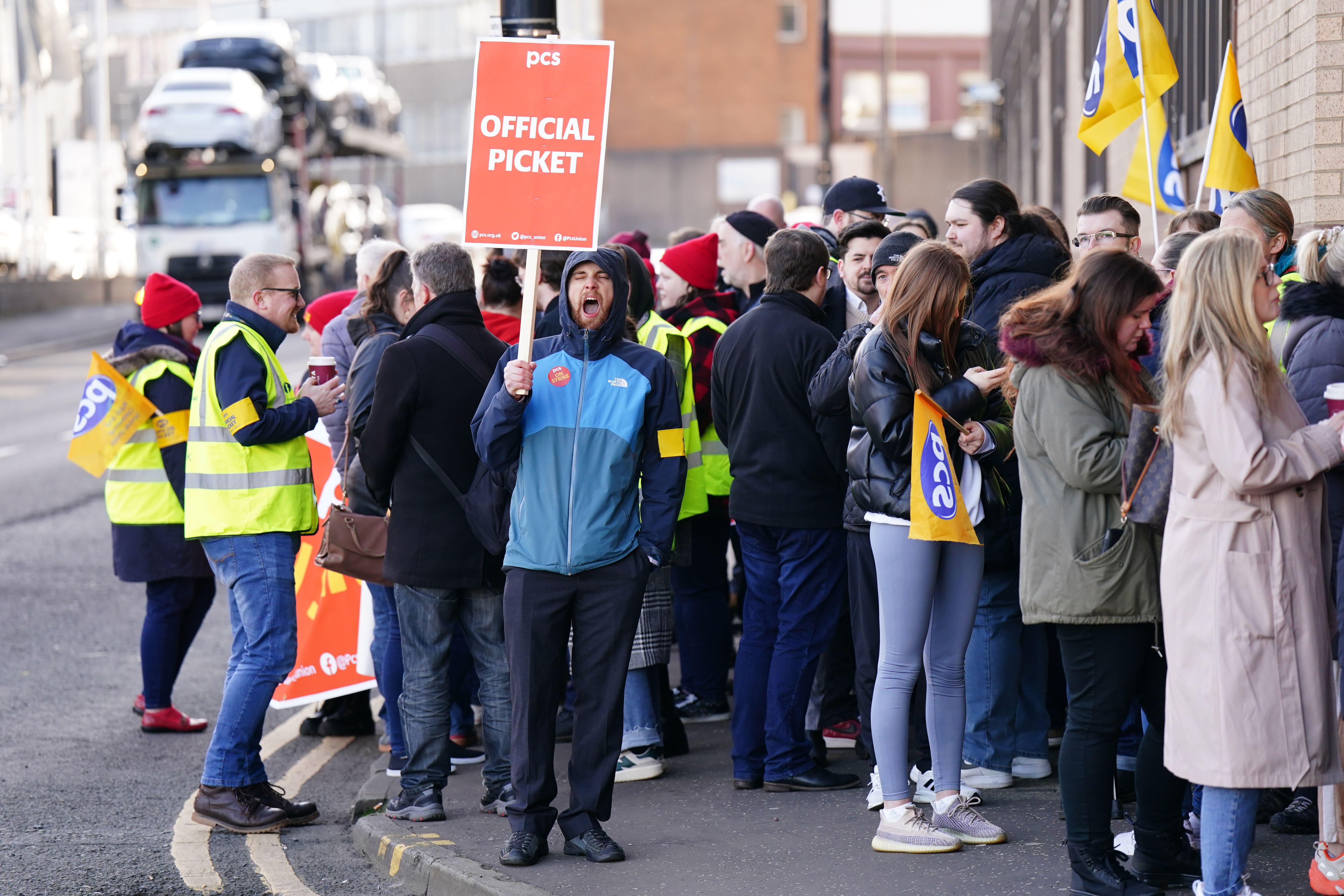 Members of the PCS union on the picket line outside the Passport Office in Glasgow (Jane Barlow/PA)