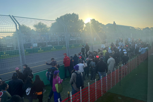 <p>A group of fans climbed the fence during the end of the Australian Grand Prix </p>