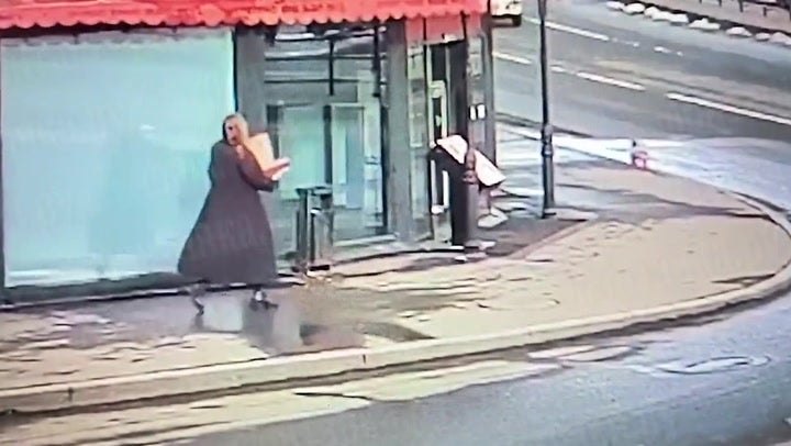 Video appears to show woman with box walking to St Petersburg cafe where blogger killed