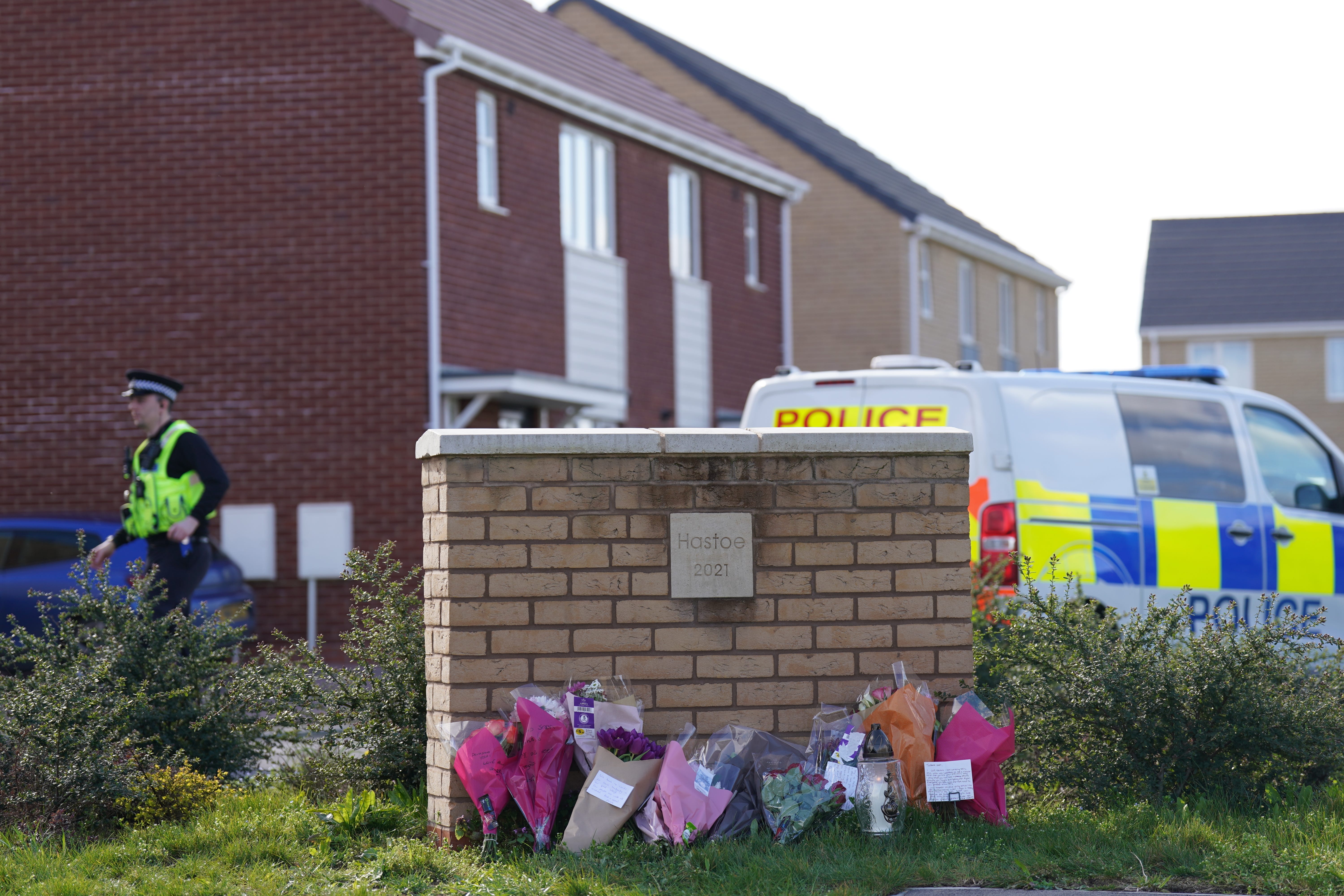 Flowers left at the scene in Bluntisham, Cambridgeshire, where police found the body of Joshua Dunmore (Joe Giddens/PA)