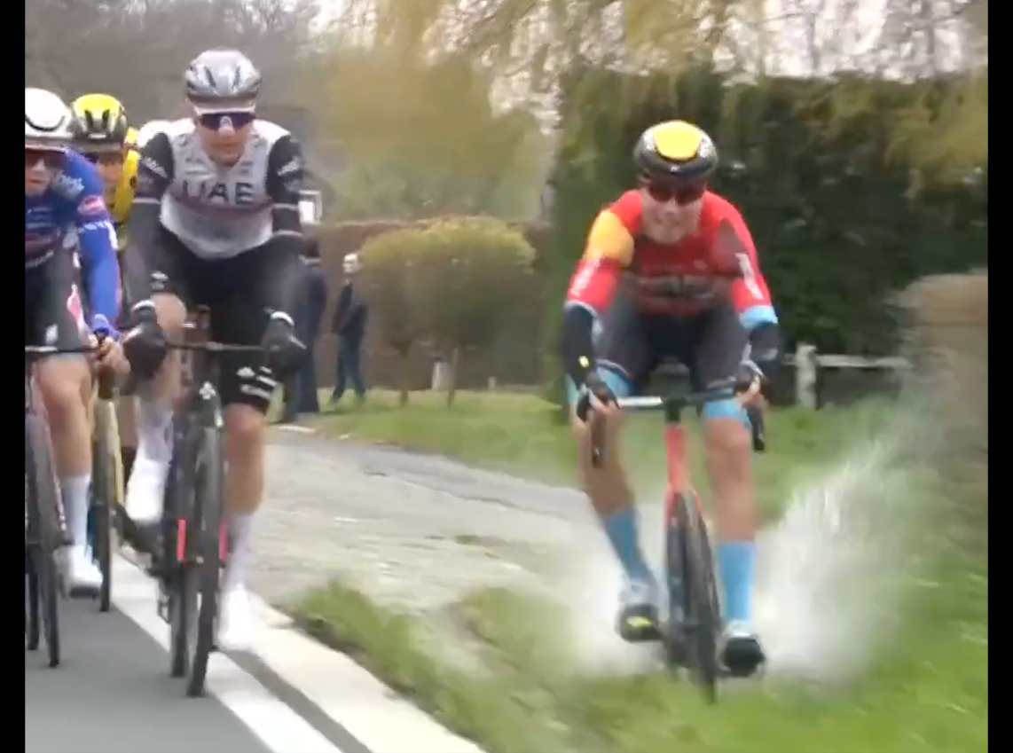 Filip Maciejuk loses control riding through a puddle on a grass verge